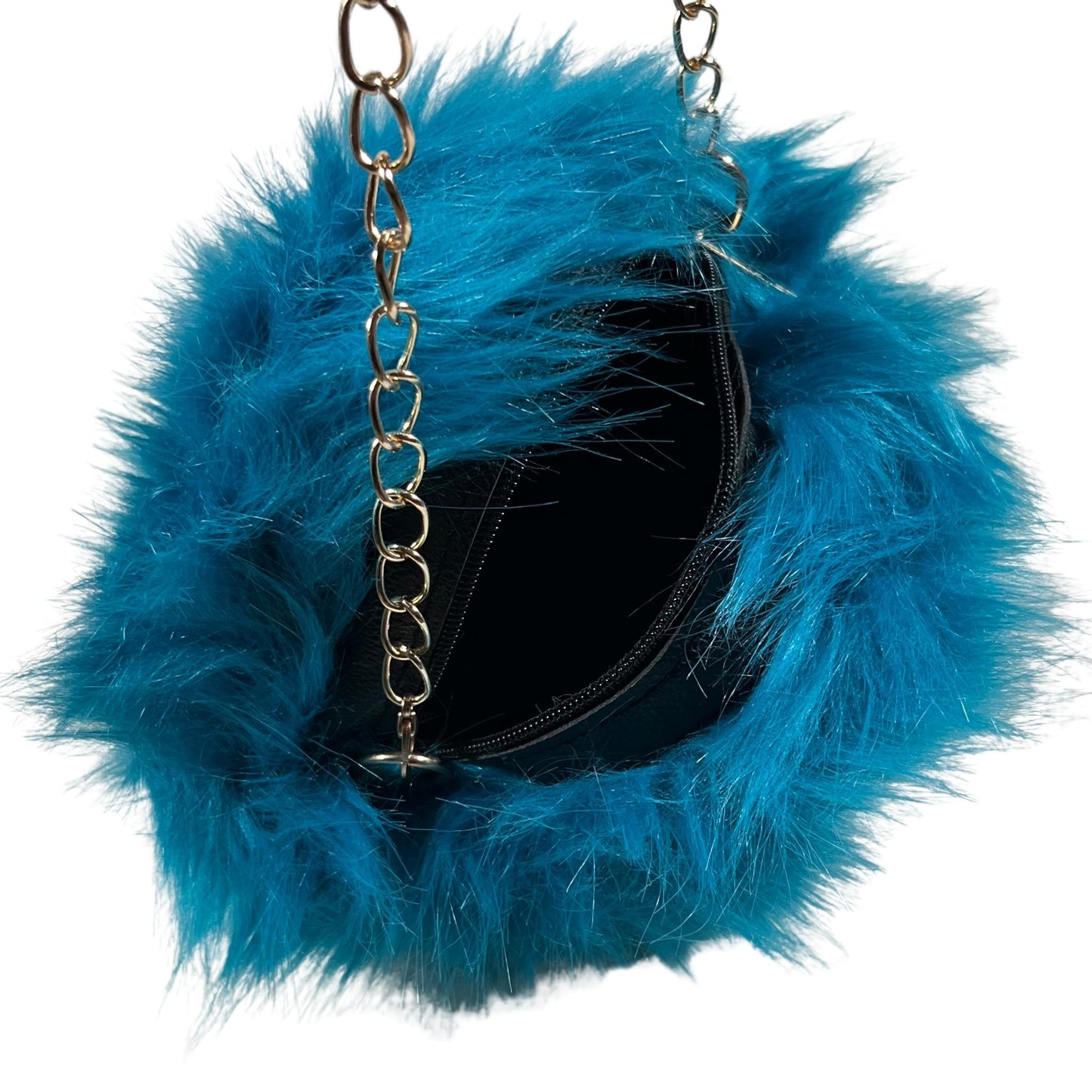 Aqua Small Rounded Faux Fur Bag With Cross Body Chain - Mary’s Twist Make a statement with our aqua small rounded faux fur bag. The soft and luxurious faux fur material adds a touch of sophistication to any outfit, while the mini round design and cross body gold chain provide a trendy and convenient way to carry your essentials.